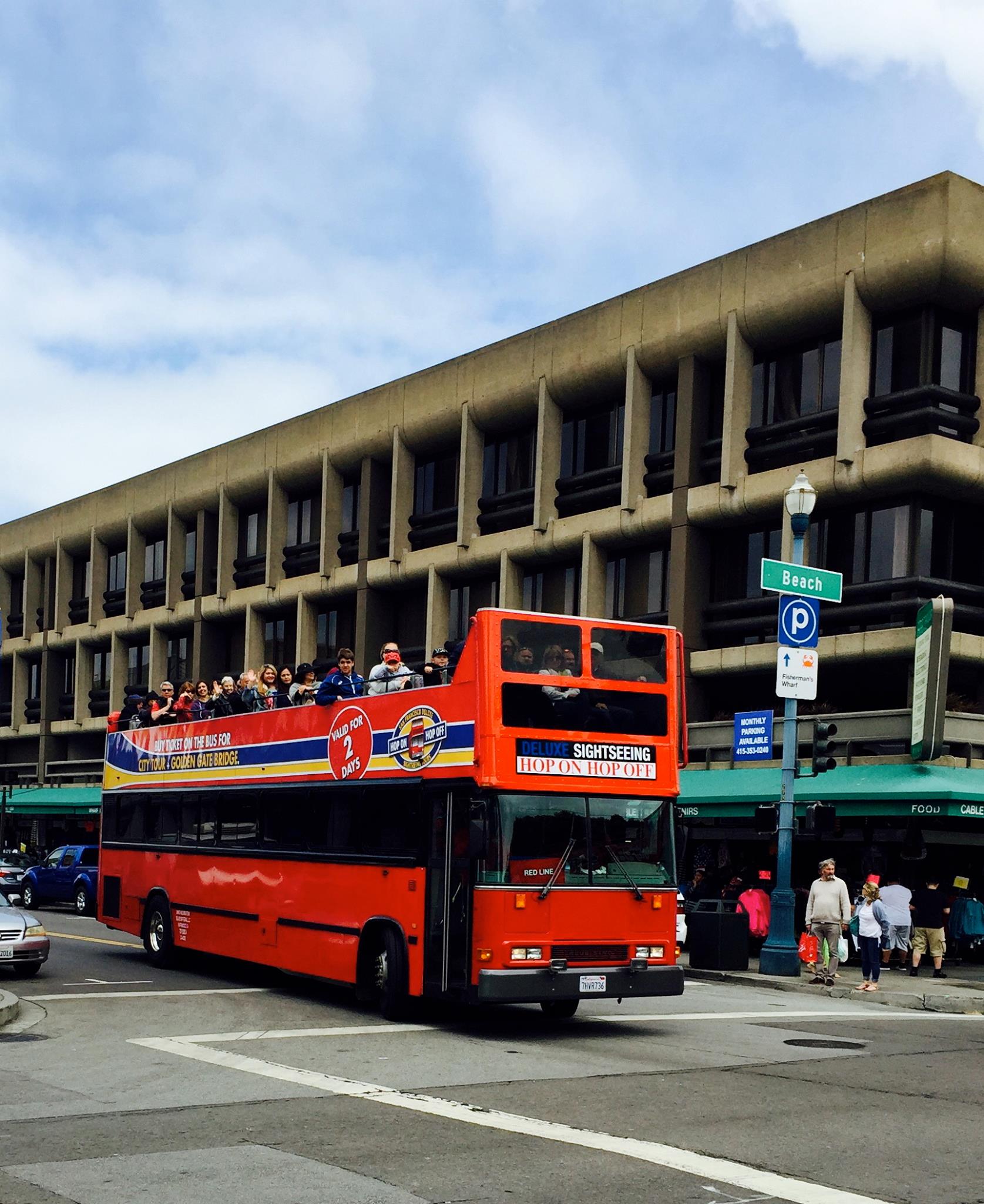 Happy riders aboard San Francisco Deluxe Sightseeing Open Top Bus