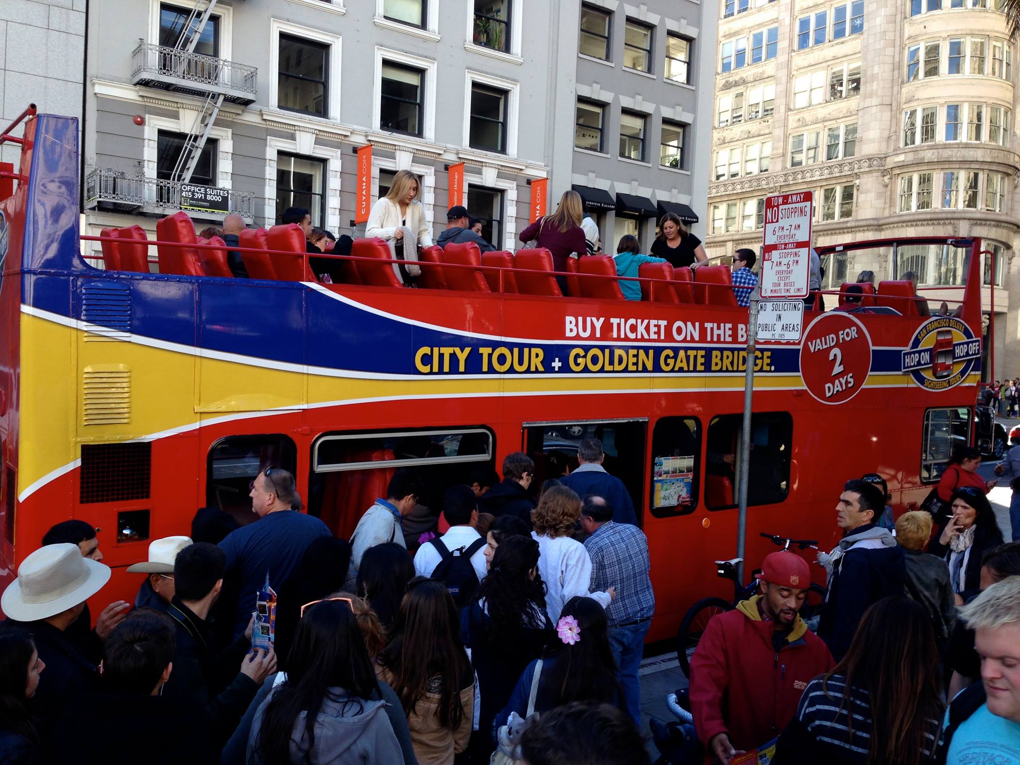 Excited tourists boarding the San Francisco Deluxe Sightseeing Super Saver Tour